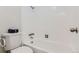 Bright bathroom with white tile and a bathtub at 1270 N Marion St # 506, Denver, CO 80218