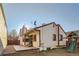 Rear exterior view featuring a patio, playset, and partial fencing at 17949 E Ohio Cir, Aurora, CO 80017