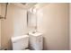 Compact bathroom with a single vanity, mirror, and toilet at 17949 E Ohio Cir, Aurora, CO 80017