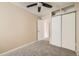 Neutral bedroom with ceiling fan, closet and carpet flooring at 17949 E Ohio Cir, Aurora, CO 80017