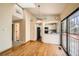 Open-concept living and dining area with wood floors and access to the kitchen at 17949 E Ohio Cir, Aurora, CO 80017
