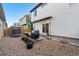 Landscaped backyard with a patio, seating area, trampoline, and a grill at 10149 Xanadu Street, Commerce City, CO 80022