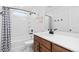 Well-lit bathroom with a white sink, modern fixtures, and classic subway tile shower at 10149 Xanadu Street, Commerce City, CO 80022