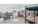 Playful bedroom with bunk beds, colorful storage, and a round alphabet rug at 10149 Xanadu Street, Commerce City, CO 80022