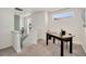 Bright hallway with a desk area, large windows, and modern decor at 10149 Xanadu Street, Commerce City, CO 80022