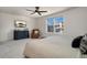 Bright and airy main bedroom features a dresser and ceiling fan at 10149 Xanadu Street, Commerce City, CO 80022