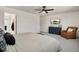 Spacious main bedroom with large window, ceiling fan, and ensuite bathroom at 10149 Xanadu Street, Commerce City, CO 80022