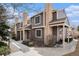 Attractive two-story townhome with brick accents, covered porches, and mature landscaping at 804 Summer Dr, Highlands Ranch, CO 80126
