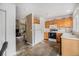 Open kitchen with wood cabinets and easy access to the living room for seamless entertaining at 804 Summer Dr, Highlands Ranch, CO 80126