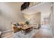 Comfortable living room with wood flooring, a cozy couch, and plenty of natural light at 804 Summer Dr, Highlands Ranch, CO 80126
