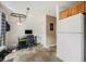 Multi-functional office space featuring a desk, storage, and easy access to kitchen appliances at 804 Summer Dr, Highlands Ranch, CO 80126