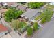 Aerial view of the home shows the backyard entertaining space with a deck and green lawn at 2703 N Milwaukee St, Denver, CO 80205