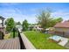View of the backyard from the back deck shows the well-maintained lawn and landscaping at 2703 N Milwaukee St, Denver, CO 80205