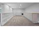 Finished basement with recessed lighting, carpet, built-in shelves, and storage at 2703 N Milwaukee St, Denver, CO 80205