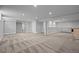 Spacious finished basement with carpet and recessed lighting, ready for customization at 2703 N Milwaukee St, Denver, CO 80205