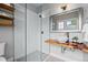 Bathroom with an attractive wood slab sink counter, bowl sink, and glass walk-in shower at 2703 N Milwaukee St, Denver, CO 80205