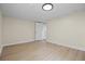 Bright bedroom features vinyl floor, closet and easy access to the bathroom with modern fixtures at 2703 N Milwaukee St, Denver, CO 80205