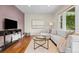 Comfortable living room featuring hardwood floors, a modern sofa, and neutral decor at 2703 N Milwaukee St, Denver, CO 80205