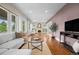 Spacious living room with hardwood floors, ample natural light, and an open layout at 2703 N Milwaukee St, Denver, CO 80205