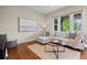 Bright living area with large windows, a comfortable sofa, and stylish decor at 2703 N Milwaukee St, Denver, CO 80205