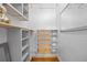 Bright walk-in closet with custom shelving and drawers for optimal storage at 2703 N Milwaukee St, Denver, CO 80205