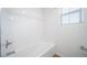 Bright white bathroom with shower and tub combination at 16131 E 111Th Dr, Commerce City, CO 80022