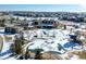 Scenic aerial view of the community featuring clubhouse, pool, and neighborhood homes at 16686 Rinker Way, Broomfield, CO 80023