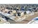 Aerial view of house and surrounding neighborhood in winter at 16686 Rinker Way, Broomfield, CO 80023