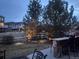 Tranquil backyard with stone bar, lights and seating; perfect for evening relaxation at 16686 Rinker Way, Broomfield, CO 80023