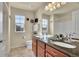 Double vanity bathroom with granite countertop at 16686 Rinker Way, Broomfield, CO 80023