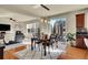 Bright dining area adjacent to kitchen with hardwood floors and patio access at 16686 Rinker Way, Broomfield, CO 80023