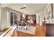 Kitchen and dining area with hardwood floors and access to a patio at 16686 Rinker Way, Broomfield, CO 80023