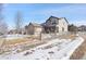 Two-story house with stone accents and a landscaped yard at 16686 Rinker Way, Broomfield, CO 80023