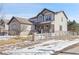Two-story house with stone accents and a landscaped yard at 16686 Rinker Way, Broomfield, CO 80023
