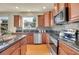 Well-equipped kitchen with granite countertops and modern appliances at 16686 Rinker Way, Broomfield, CO 80023