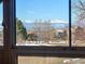Stunning mountain views seen from a window of the house at 16686 Rinker Way, Broomfield, CO 80023