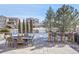 Stone patio with dining and bar areas at 16686 Rinker Way, Broomfield, CO 80023