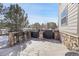 Outdoor kitchen and bar on stone patio at 16686 Rinker Way, Broomfield, CO 80023