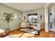 Sitting area with hardwood floors and access to dining area at 16686 Rinker Way, Broomfield, CO 80023