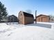 Spacious backyard with detached shop and shed, perfect for storage at 245 Cedar St, Hudson, CO 80642