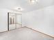 Basement bedroom with mirrored closet doors at 245 Cedar St, Hudson, CO 80642