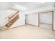 Unfinished basement with carpeted floor and ample space at 245 Cedar St, Hudson, CO 80642