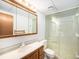 Clean bathroom with shower and wood vanity at 245 Cedar St, Hudson, CO 80642