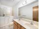 Bathroom features a walk-in shower and double vanity at 245 Cedar St, Hudson, CO 80642