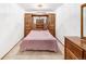 Basement bedroom with wood furniture and carpeting at 245 Cedar St, Hudson, CO 80642