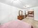 Spacious bedroom with mirrored closet doors and wood dresser at 245 Cedar St, Hudson, CO 80642