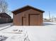 Detached garage with single door and large garage door at 245 Cedar St, Hudson, CO 80642