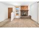 Living room with a stone fireplace and wood mantel at 245 Cedar St, Hudson, CO 80642