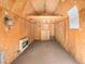 Interior of a workshop with loft storage and heater at 245 Cedar St, Hudson, CO 80642