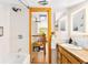 Bathroom featuring a wooden vanity, a shower and tub, and a view into the upper floor at 200 The Lane Rd, Golden, CO 80403